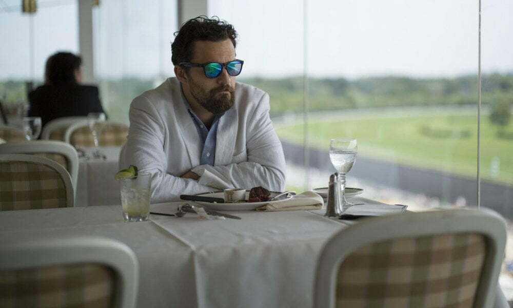 Jake Johnson in “Win It All.” Credit...Netflix